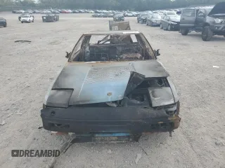 1986 Toyota MR2 z VIN JT2AW15CXG0066425, wystawiony jako Copart lot #74560234 z przebiegiem Nie podano mil oraz Nie do naprawy. Historia ofert i sprzedaży dostępna na DreamBid. Obrazek 5.