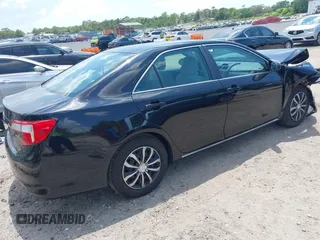 2014 Toyota Camry L with VIN 4T4BF1FKXER402857, listed as a IAAI auction lot 42144757 with 192,081 mi miles and . Bid and sale history available at DreamBid. Image 4.