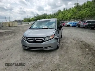 2016 Honda Odyssey SE with VIN 5FNRL5H31GB109718, listed as a Copart auction lot 54689915 with 48,933 mi miles and Salvage Title. Bid and sale history available at DreamBid. Image 14.