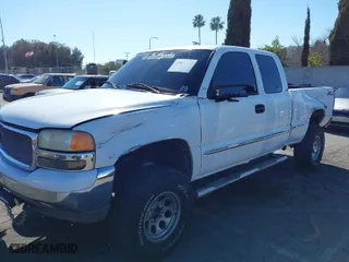 2000 GMC Sierra 1500 SLT with VIN 1GTEC19T7YZ241853, listed as a IAAI auction lot 41657692 with 166,517 mi miles. Bid and sale history available at carsss.com. Image 6.
