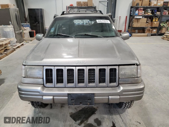 1997 Jeep Grand Cherokee Limited with VIN 1J4GZ78Y4VC589688, listed as a Copart auction lot 84673974 with 183,930 mi miles and Salvage Title. Bid and sale history available at carsss.com. Image 5.