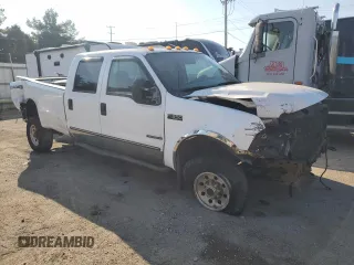 2000 Ford F-350 XL with VIN 1FTSW31F7YED79895, listed as a Copart auction lot 71744804 with 176,241 mi miles and Salvage Title. Bid and sale history available at DreamBid. Image 4.