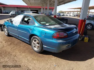 2003 Pontiac Grand Prix GT with VIN 1G2WP52K13F152876, listed as a IAAI auction lot 41426333 with 258,237 mi miles. Bid and sale history available at carsss.com. Image 3.