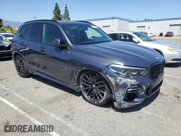 2021 BMW X5 xDrive40i with VIN 5UXCR6C06M9H65380, listed as a Copart auction lot 57445405 with 33,916 mi miles and Salvage title. Bid and sale history available at DreamBid. Image 4.