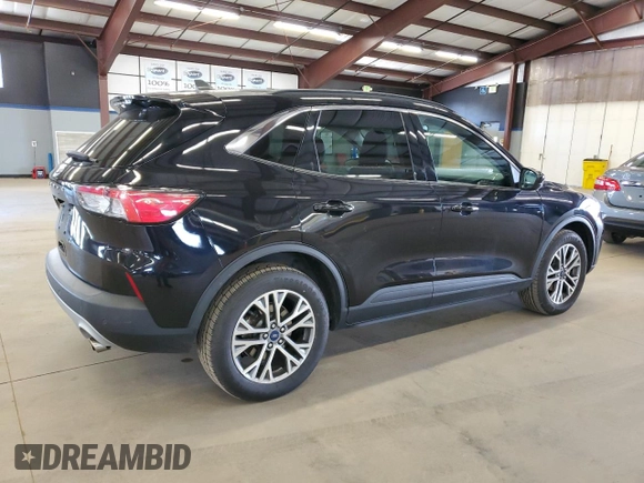2021 Ford Escape SEL with VIN 1FMCU9H64MUA50988, listed as a Copart auction lot 54517685 with 122,593 mi miles and Salvage Title. Bid and sale history available at DreamBid. Image 3.