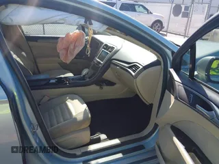 2014 Ford Fusion SE Hybrid with VIN 3FA6P0LU3ER373311, listed as a IAAI auction lot 42048513 with 155,935 mi miles. Bid and sale history available at carsss.com. Image 5.