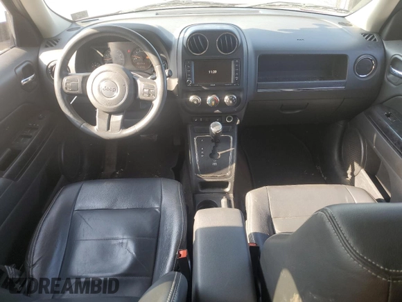 2015 Jeep Patriot High Altitude with VIN 1C4NJRFBXFD272296, listed as a Copart auction lot 62051095 with 118,496 mi miles and Salvage title. Bid and sale history available at DreamBid. Image 8.