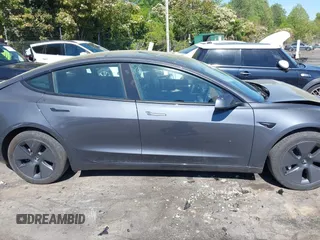 2023 Tesla Model 3 with VIN 5YJ3E1EA6PF645110, listed as a IAAI auction lot 42044357 with 24,352 mi miles and . Bid and sale history available at DreamBid. Image 13.