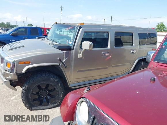 2004 Hummer H2 z VIN 5GRGN23U34H105809, wystawiony jako IAAI lot #42456055 z przebiegiem Nie podano mil oraz . Historia ofert i sprzedaży dostępna na DreamBid. Obrazek 14.