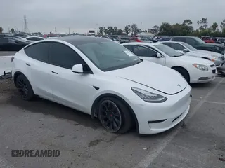 2023 Tesla Model Y Long Range with VIN 7SAYGDEE3PA055497, listed as a IAAI auction lot 42396529 with 18,230 mi miles and . Bid and sale history available at DreamBid. Image 1.