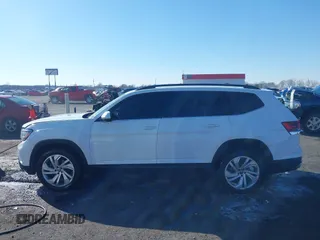 2021 Volkswagen Atlas SE z VIN 1V2WR2CA4MC514968, wystawiony jako IAAI lot #41414547 z przebiegiem 133 946 mil mil oraz . Historia ofert i sprzedaży dostępna na DreamBid. Obrazek 14.