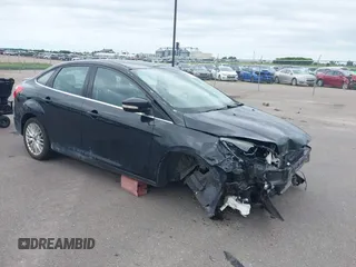 2014 Ford Focus Titanium with VIN 1FADP3J26EL316979, listed as a IAAI auction lot 42547096 with 118,222 mi miles and . Bid and sale history available at DreamBid. Image 1.