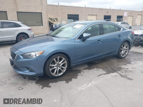 2014 Mazda 6 i Grand Touring with VIN JM1GJ1W64E1133729, listed as a IAAI auction lot 42050222 with 112,464 mi miles and . Bid and sale history available at DreamBid. Image 2.