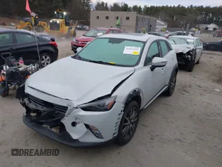 2016 Mazda CX-3 Grand Touring with VIN JM1DKFD7XG0132084, listed as a IAAI auction lot 41004954 with 70,476 mi miles. Bid and sale history available at carsss.com. Image 17.