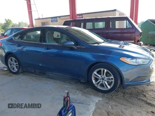 2018 Ford Fusion SE z VIN 3FA6P0HD8JR201052, wystawiony jako IAAI lot #42367050 z przebiegiem 90 502 mil mil oraz . Historia ofert i sprzedaży dostępna na DreamBid. Obrazek 13.