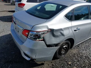 2018 Nissan Sentra S with VIN 3N1AB7AP6JY292055, listed as a IAAI auction lot 41883754 with 65,703 mi miles and . Bid and sale history available at DreamBid. Image 6.
