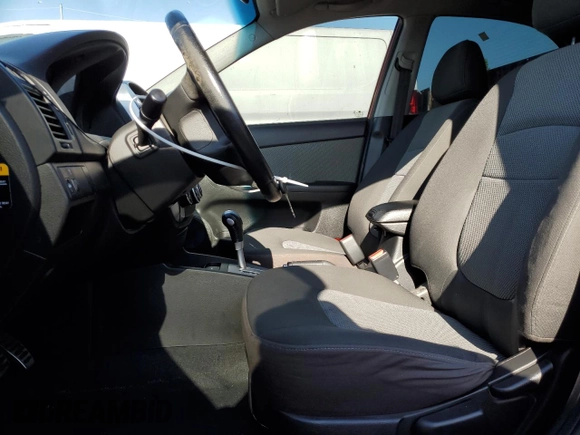 2009 Kia Spectra EX with VIN KNAFE222995027376, listed as a Copart auction lot 52406025 with 73,692 mi miles and Salvage Title. Bid and sale history available at DreamBid. Image 7.