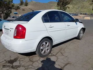 2006 Hyundai Accent GLS with VIN KMHCN46C36U040545, listed as a IAAI auction lot 42021545 with 224,058 mi miles. Bid and sale history available at carsss.com. Image 4.