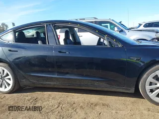 2022 Tesla Model 3 with VIN 5YJ3E1EA9NF295890, listed as a IAAI auction lot 41175917 with 42,230 mi miles and . Bid and sale history available at DreamBid. Image 14.