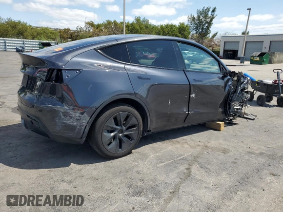 2025 Tesla Model Y Long Range with VIN 7SAYGDED8SF241779, listed as a Copart auction lot 51899205 with 12,409 mi miles and Salvage Title. Bid and sale history available at DreamBid. Image 3.