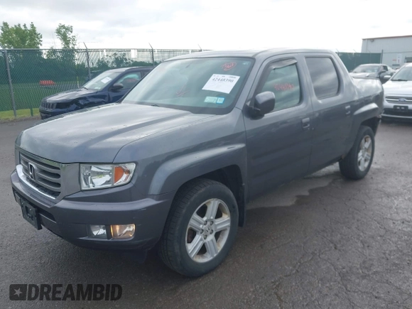 2014 Honda Ridgeline RTL with VIN 5FPYK1F5XEB011772, listed as a IAAI auction lot 42440390 with 145,219 mi miles and . Bid and sale history available at DreamBid. Image 2.