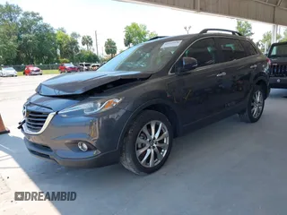 2014 Mazda CX-9 Grand Touring z VIN JM3TB2DA0E0434181, wystawiony jako IAAI lot #42295436 z przebiegiem 78 372 mil mil oraz . Historia ofert i sprzedaży dostępna na DreamBid. Obrazek 2.