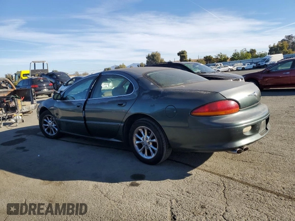 2001 Chrysler LHS z VIN 2C3AC56G31H606648, wystawiony jako Copart lot #77123814 z przebiegiem 83 574 mil mil oraz Tytuł czysty. Historia ofert i sprzedaży dostępna na DreamBid. Obrazek 2.