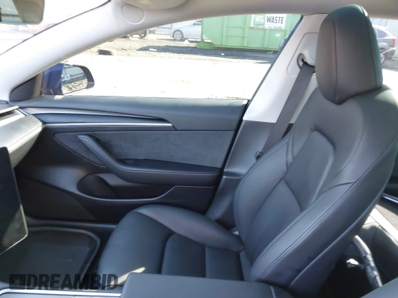 2023 Tesla Model 3 Long Range with VIN 5YJ3E1EB0PF688172, listed as a IAAI auction lot 41411580 with 21,125 mi miles and . Bid and sale history available at DreamBid. Image 5.