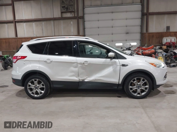 2016 Ford Escape Titanium with VIN 1FMCU9J95GUB02377, listed as a IAAI auction lot 41869557 with 88,441 mi miles. Bid and sale history available at carsss.com. Image 13.