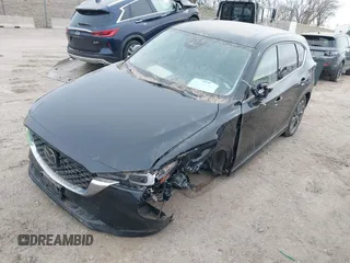 2023 Mazda CX-5 S Premium with VIN JM3KFBDM2P0221973, listed as a IAAI auction lot 41853756 with Not Provided miles and . Bid and sale history available at DreamBid. Image 6.