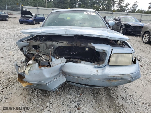 1999 Ford Crown Victoria LX with VIN 2FAFP74WXXX137154, listed as a Copart auction lot 71418784 with 97,589 mi miles and Salvage Title. Bid and sale history available at carsss.com. Image 5.