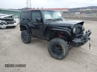 2014 Jeep Wrangler Sahara with VIN 1C4AJWBG9EL311477, listed as a IAAI auction lot 41884255 with 82,221 mi miles and . Bid and sale history available at carsss.com. Image 1.