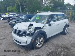 2014 MINI Countryman z VIN WMWZB3C50EWR37412, wystawiony jako IAAI lot #42330526 z przebiegiem 139 310 mil mil oraz . Historia ofert i sprzedaży dostępna na DreamBid. Obrazek 6.