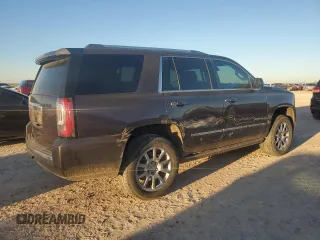 2015 GMC Yukon Denali with VIN 1GKS1CKJ7FR132677, listed as a Copart auction lot 82118584 with 144,798 mi miles and Salvage Title. Bid and sale history available at carsss.com. Image 3.