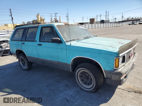 1991 GMC Jimmy z VIN 1GKCS13Z2M2518231, wystawiony jako Copart lot #64115274 z przebiegiem 132 698 mil mil oraz Czysty tytuł • Clean title. Historia ofert i sprzedaży dostępna na DreamBid. Obrazek 4.