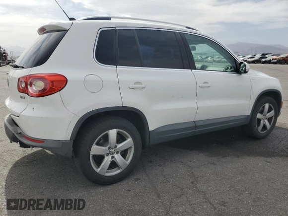 2010 Volkswagen Tiguan Wolfsburg Edition with VIN WVGAV7AX7AW003188, listed as a Copart auction lot 56692535 with 121,502 mi miles and Salvage title. Bid and sale history available at DreamBid. Image 3.