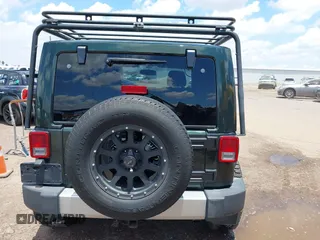 2012 Jeep Wrangler Sahara z VIN 1C4AJWBGXCL100527, wystawiony jako IAAI lot #42394623 z przebiegiem 126 097 mil mil oraz . Historia ofert i sprzedaży dostępna na DreamBid. Obrazek 16.