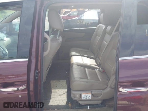2014 Honda Odyssey Touring with VIN 5FNRL5H90EB120999, listed as a IAAI auction lot 42541370 with 96,454 mi miles and . Bid and sale history available at DreamBid. Image 8.