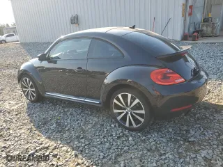 2012 Volkswagen Beetle 2.0T Turbo w/Sun/Sound PZEV with VIN 3VWVA7AT5CM635721, listed as a Copart auction lot 75693314 with 181,890 mi miles and Salvage Title. Bid and sale history available at carsss.com. Image 2.