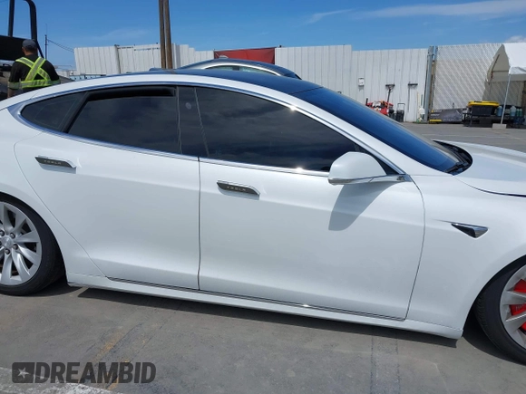 2018 Tesla Model S 75D with VIN 5YJSA1E25JF245269, listed as a IAAI auction lot 41914567 with 56,086 mi miles and . Bid and sale history available at DreamBid. Image 14.