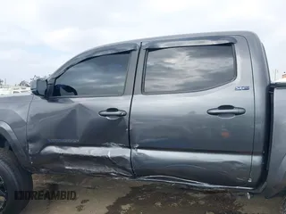 2018 Toyota Tacoma SR5 with VIN 5TFAZ5CNXJX066952, listed as a IAAI auction lot 41894562 with 141,818 mi miles and . Bid and sale history available at DreamBid. Image 14.