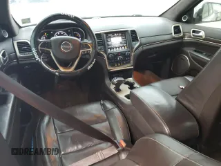 2015 Jeep Grand Cherokee Summit with VIN 1C4RJEJG8FC131925, listed as a Copart auction lot 55270785 with 130,425 mi miles and Salvage title. Bid and sale history available at DreamBid. Image 8.