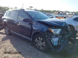 2018 Toyota RAV4 LE with VIN JTMZFREV1JJ203943, listed as a IAAI auction lot 41921863 with 104,691 mi miles. Bid and sale history available at carsss.com. Image 1.