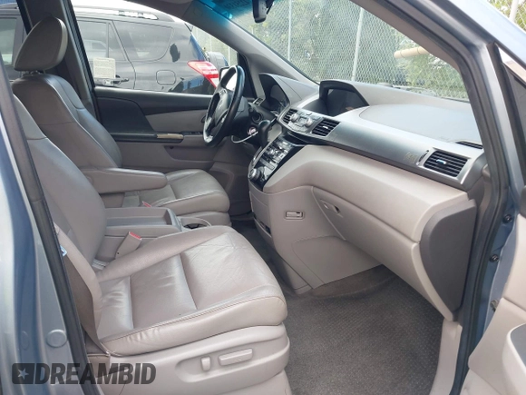 2012 Honda Odyssey EX-L with VIN 5FNRL5H60CB095086, listed as a IAAI auction lot 42251330 with 144,232 mi miles and . Bid and sale history available at DreamBid. Image 5.