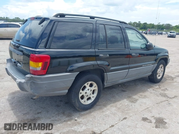 2002 Jeep Grand Cherokee Laredo with VIN 1J4GX48S22C226527, listed as a IAAI auction lot 42630457 with 197,333 mi miles and . Bid and sale history available at DreamBid. Image 4.