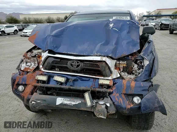 2014 Toyota Tacoma with VIN 5TFLU4EN7EX106909, listed as a Copart auction lot 46906235 with 102,681 mi miles and Salvage Title. Bid and sale history available at DreamBid. Image 11.