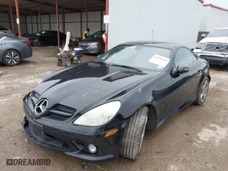2006 Mercedes-Benz SLK-Class 3.5L with VIN WDBWK56FX6F084328, listed as a IAAI auction lot 41570145 with 104,929 mi miles. Bid and sale history available at carsss.com. Image 2.
