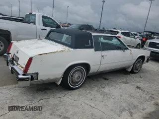 1984 Cadillac Eldorado z VIN 1G6AL5783EE654296, wystawiony jako Copart lot #74945374 z przebiegiem 37 040 mil mil oraz Szkody całkowita. Historia ofert i sprzedaży dostępna na DreamBid. Obrazek 3.