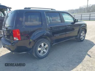 2009 Honda Pilot EX-L with VIN 5FNYF48529B035128, listed as a IAAI auction lot 42006450 with 214,069 mi miles. Bid and sale history available at carsss.com. Image 4.