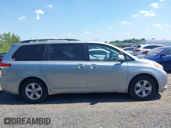2011 Toyota Sienna LE AAS with VIN 5TDKK3DC2BS096965, listed as a IAAI auction lot 42583783 with 288,489 mi miles and . Bid and sale history available at DreamBid. Image 13.